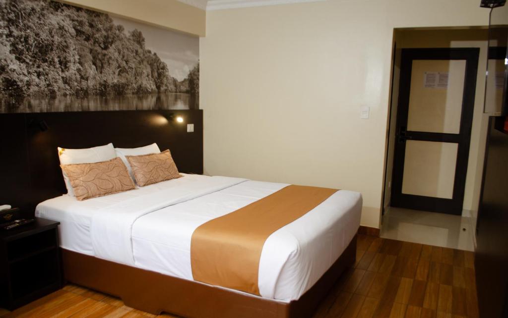 Postel nebo postele na pokoji v ubytování Hotel María Luisa