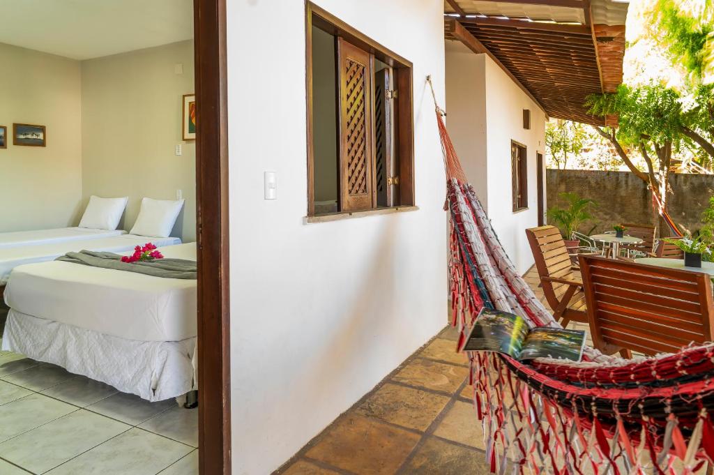 Cama ou camas em um quarto em Casa Suiça Brasileira