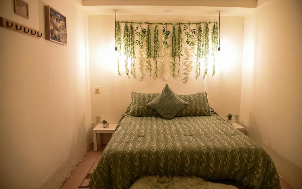 Postel nebo postele na pokoji v ubytování Xochi Calli