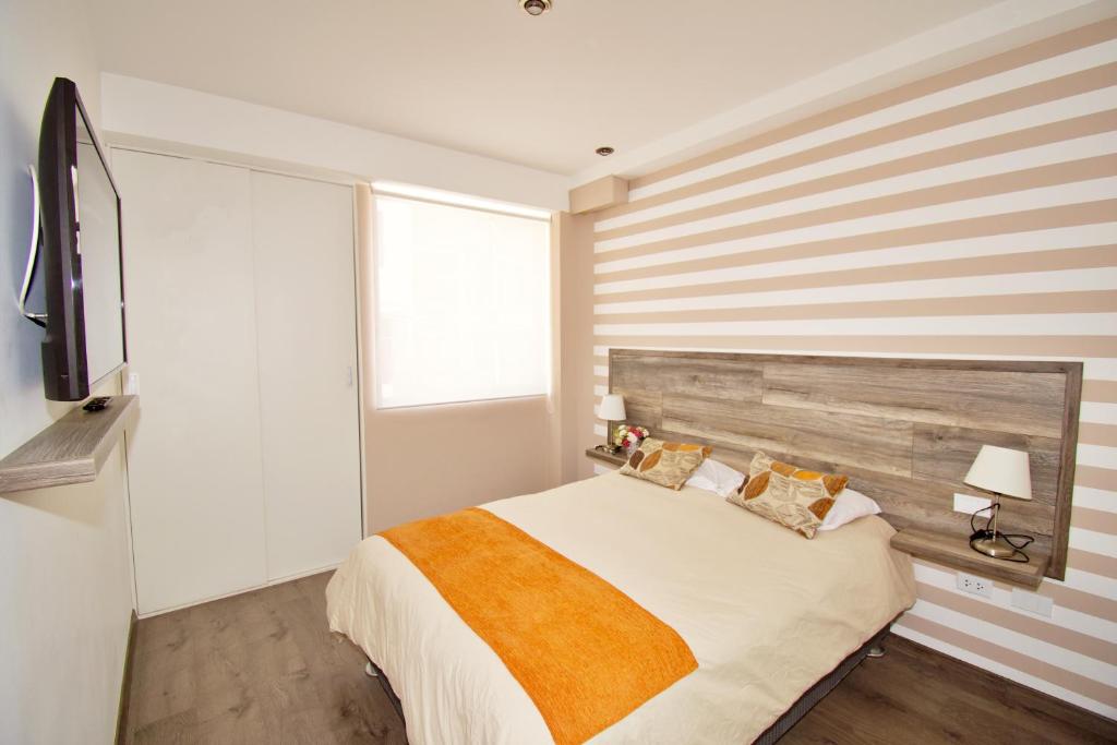 Postel nebo postele na pokoji v ubytování Basadre Apart Hotel