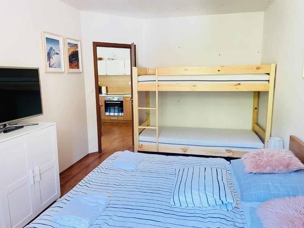 Postel nebo postele na pokoji v ubytování Apartmán HOREHRONIE