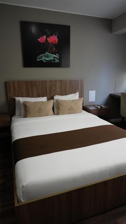 Postel nebo postele na pokoji v ubytování Equo Hotel Boutique