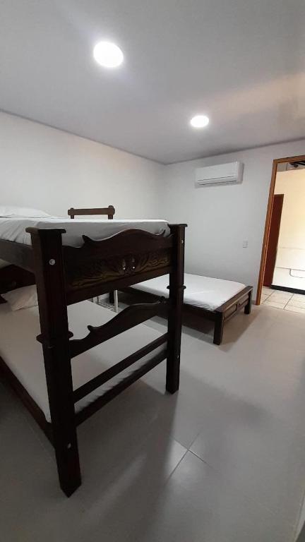 Llit o llits en una habitació de Posada San Carlos