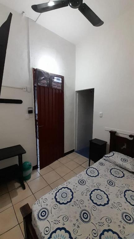 Llit o llits en una habitació de Posada San Carlos