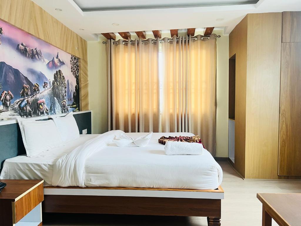Cama o camas de una habitación en Hotel Nirakar