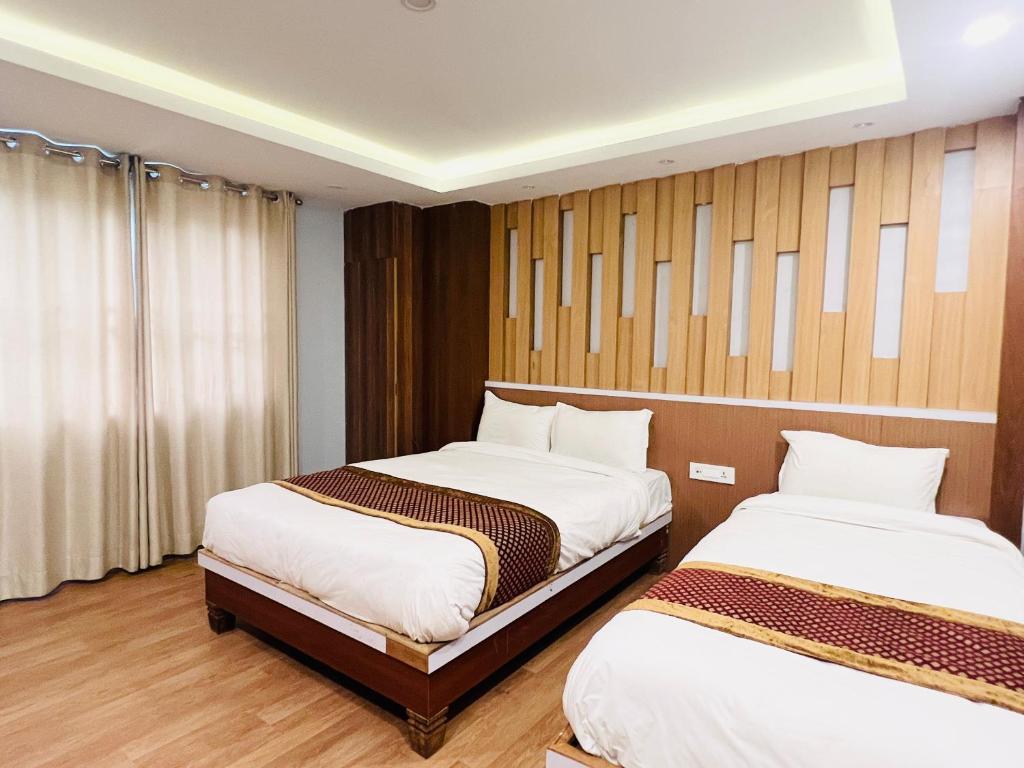 Cama o camas de una habitación en Hotel Nirakar