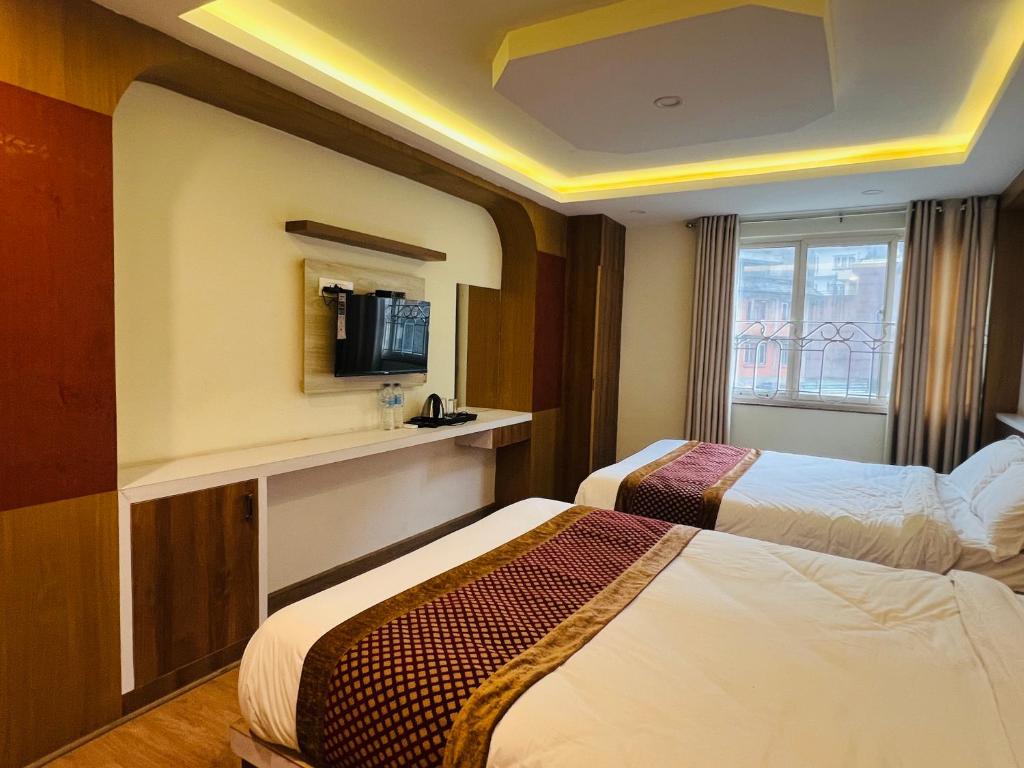 Cama o camas de una habitación en Hotel Nirakar