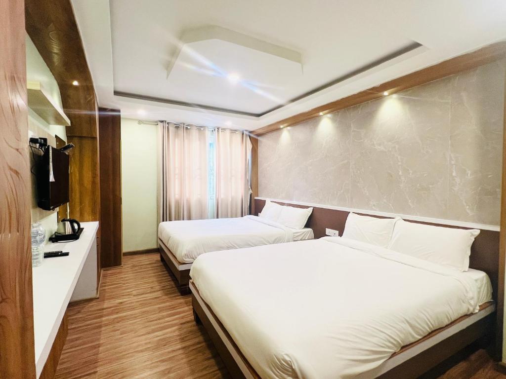 Cama o camas de una habitación en Hotel Nirakar