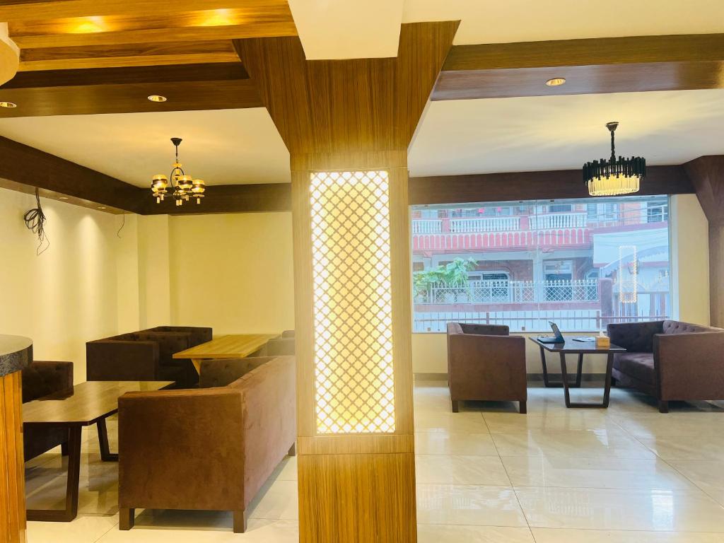Zona de estar de Hotel Nirakar