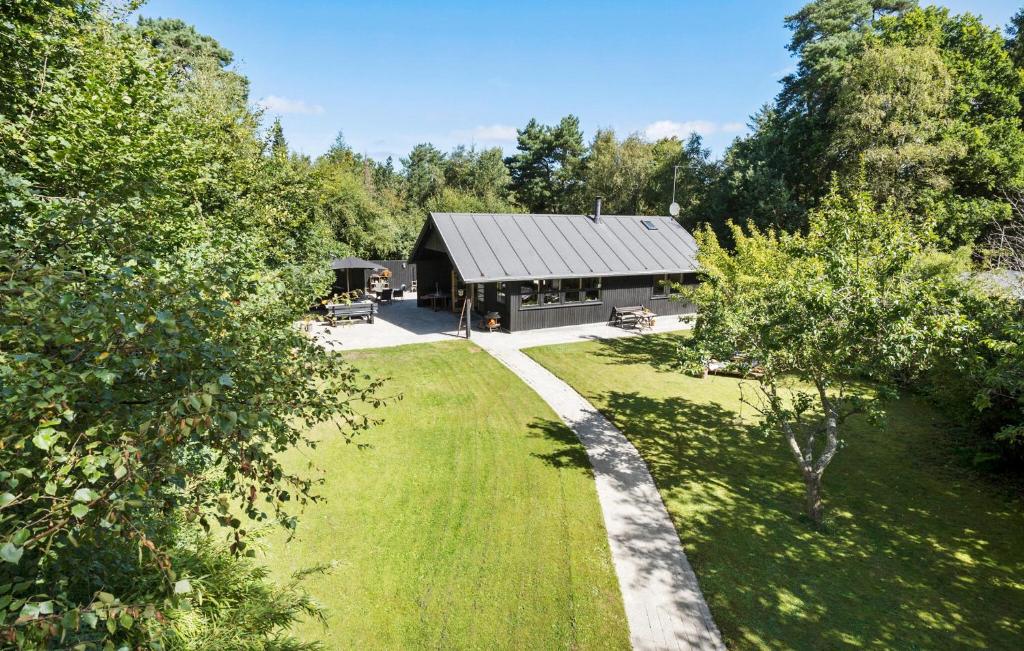 an aerial view of a house with a yard at 4 Bedroom Beautiful Home In Nykøbing Sj in Nykøbing Sjælland