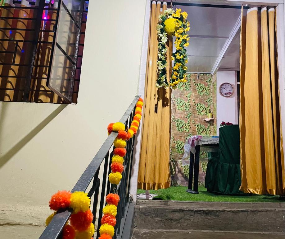a stairway with a garland of flowers on it at Namaskar Lodge and Homestay in Guwahati