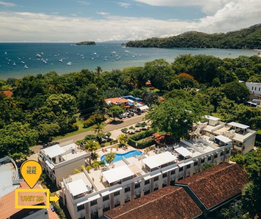 an aerial view of a resort and the ocean at Pacific Sunset Ground Unit Condo Across The Beach in Coco
