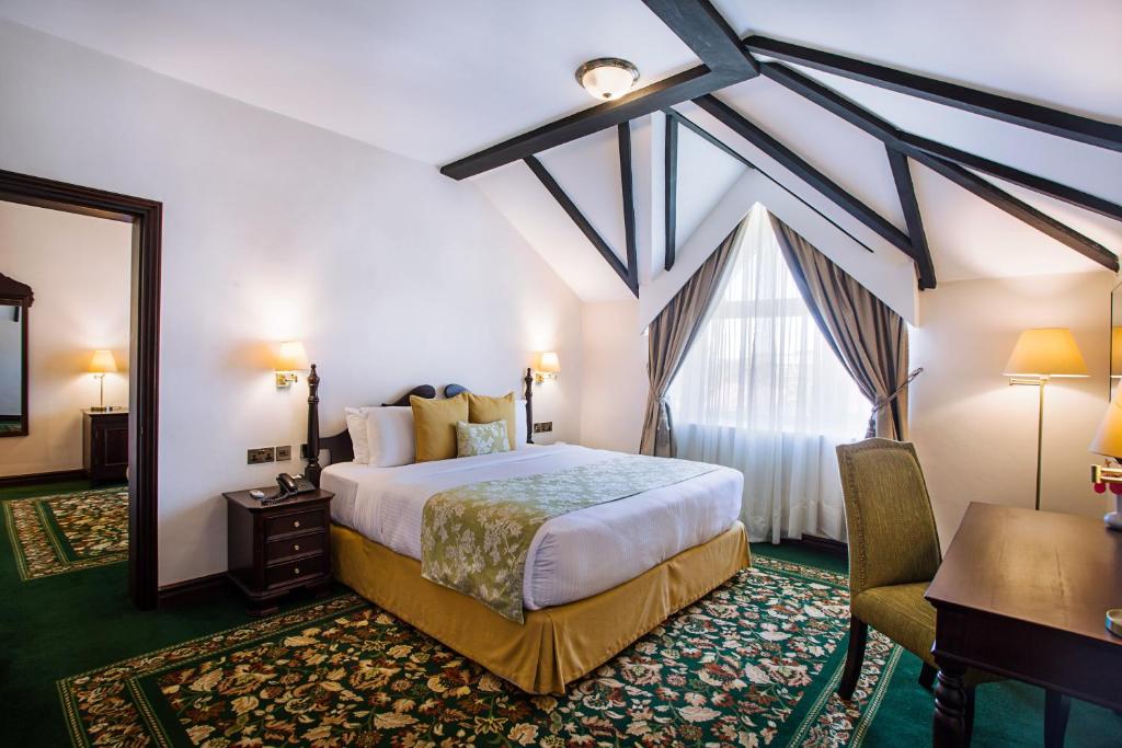Postel nebo postele na pokoji v ubytování Midland Hotel Nakuru