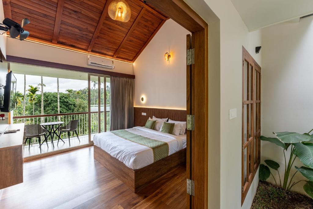 Postel nebo postele na pokoji v ubytování Theyila Wayanad Premium Pool Resort