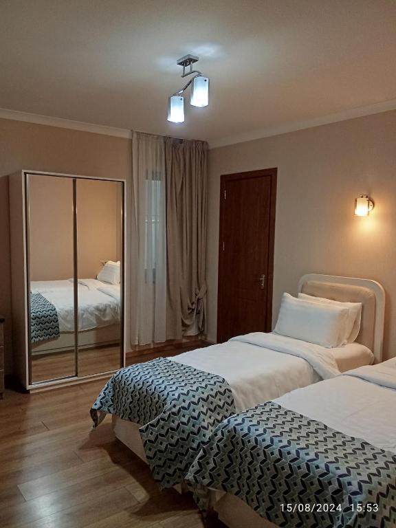 Postel nebo postele na pokoji v ubytování Grand Hotel Bennet