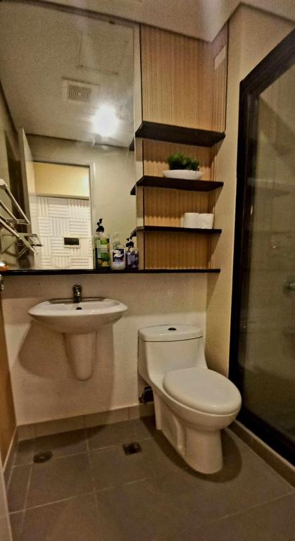 a bathroom with a toilet and a sink at Avida Davao Condos, downtown CM Recto Avenue, Davao City in Davao City
