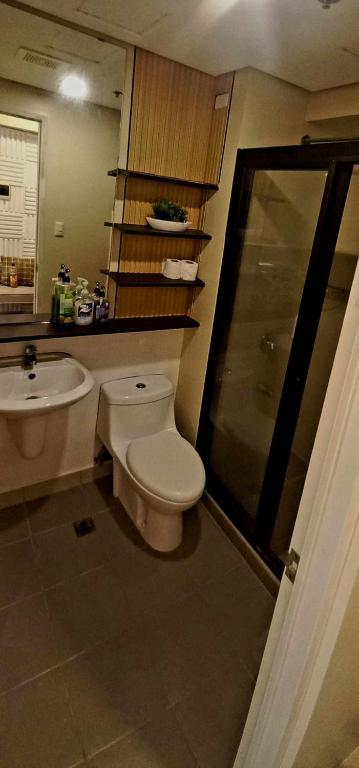 a bathroom with a toilet and a sink at Avida Davao Condos, downtown CM Recto Avenue, Davao City in Davao City