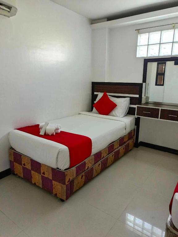 Postel nebo postele na pokoji v ubytování Ecoland 88 Apartelle & Suite