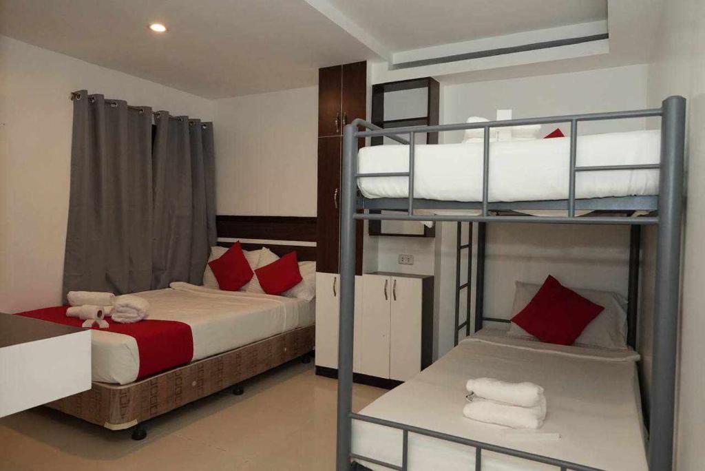 Postel nebo postele na pokoji v ubytování Ecoland 88 Apartelle & Suite