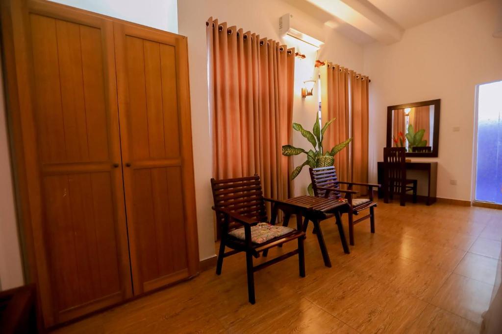 Posezení v ubytování Nibbana Mirissa Hotel