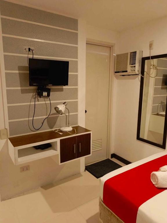 TV a/nebo společenská místnost v ubytování Ecoland 88 Apartelle & Suite