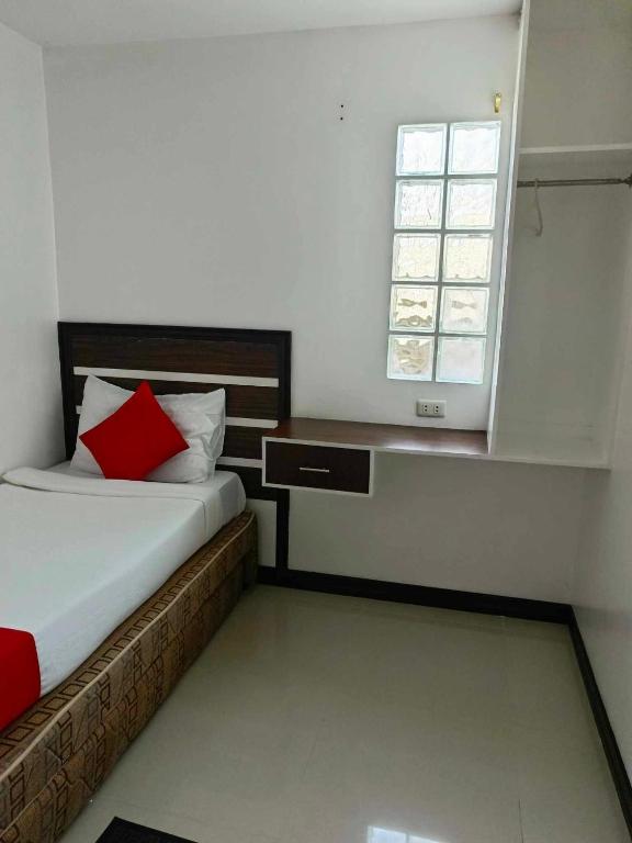 Postel nebo postele na pokoji v ubytování Ecoland 88 Apartelle & Suite