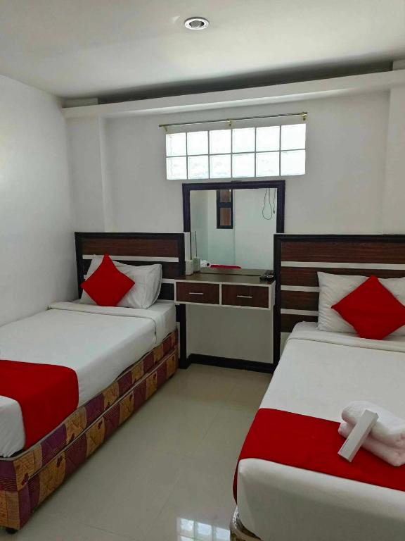 Postel nebo postele na pokoji v ubytování Ecoland 88 Apartelle & Suite
