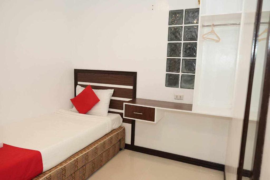 Postel nebo postele na pokoji v ubytování Ecoland 88 Apartelle & Suite