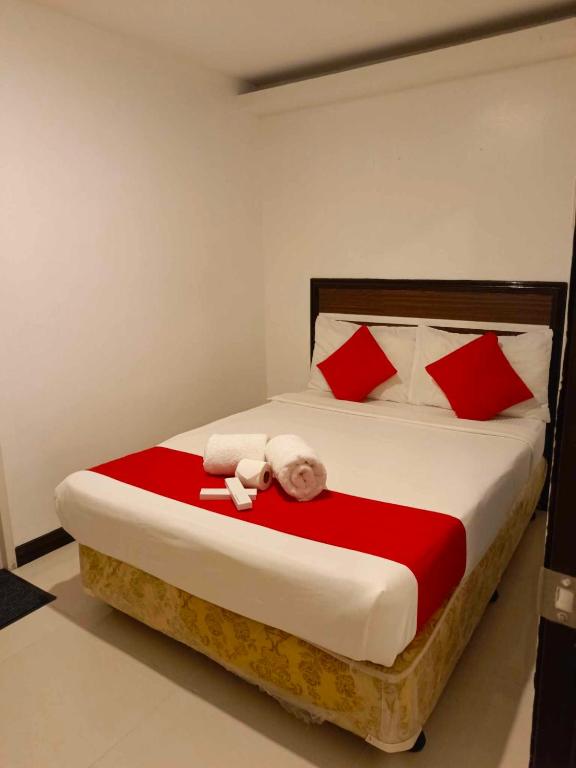 Postel nebo postele na pokoji v ubytování Ecoland 88 Apartelle & Suite