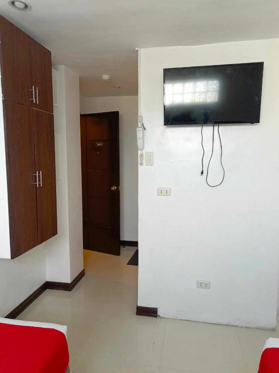 TV a/nebo společenská místnost v ubytování Ecoland 88 Apartelle & Suite