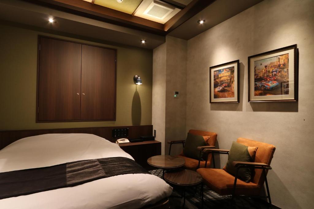 Postel nebo postele na pokoji v ubytování HOTEL Us Bentenbashi Adult only