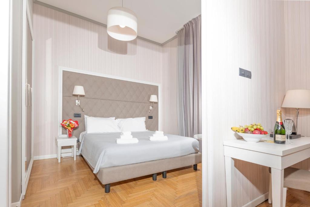 Postel nebo postele na pokoji v ubytování Spa & Wellness by Des Anglais " Accesso SPA compreso"