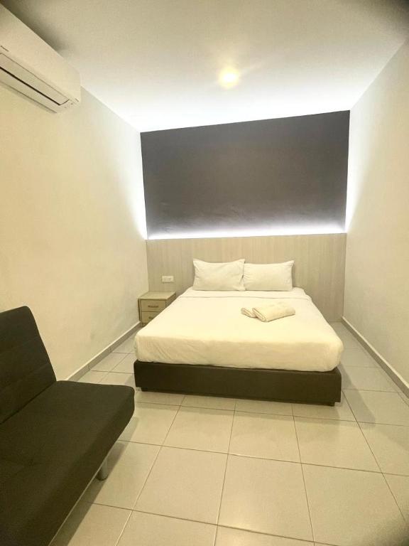 Postel nebo postele na pokoji v ubytování Garden Inns Motel