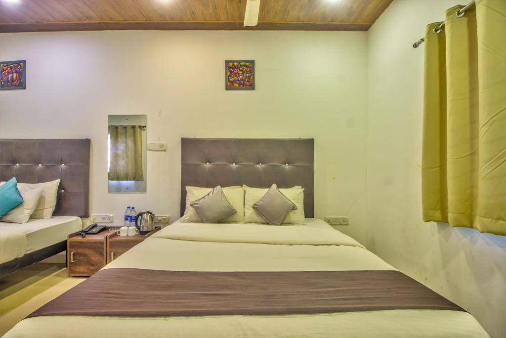 Postel nebo postele na pokoji v ubytování The Balaji inn Baga