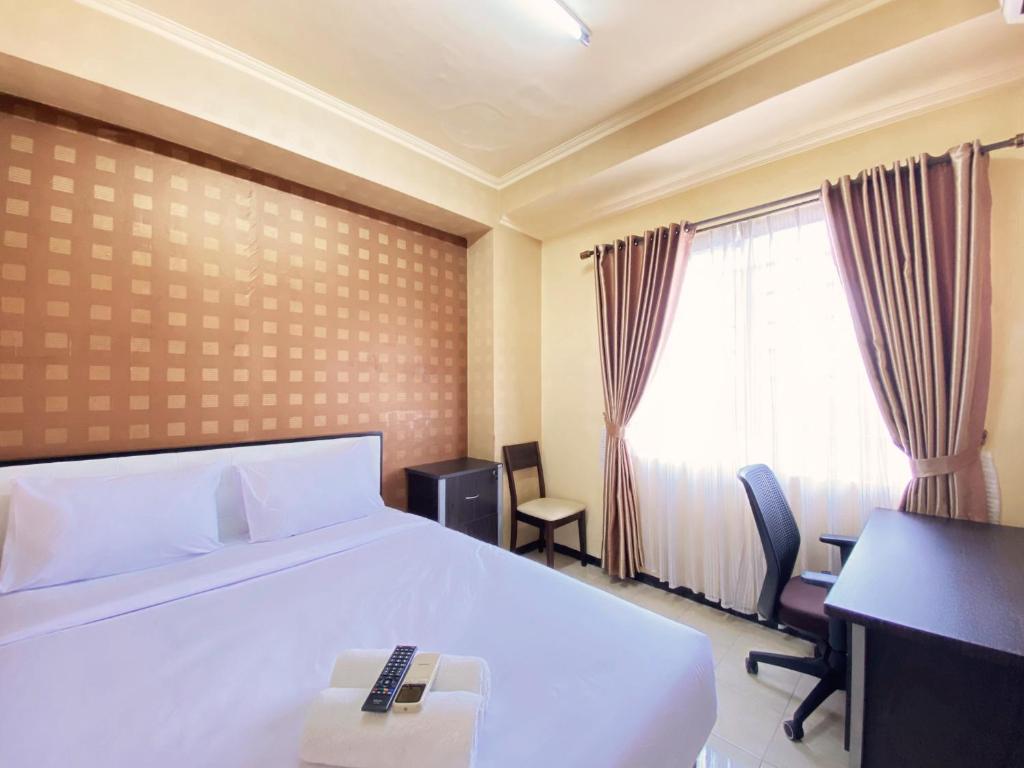 Ένα ή περισσότερα κρεβάτια σε δωμάτιο στο Great Choice 2BR at The Edge Bandung Apartment By Travelio