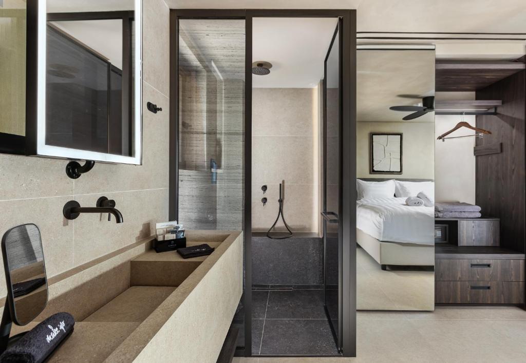 Postel nebo postele na pokoji v ubytování Omega Residences