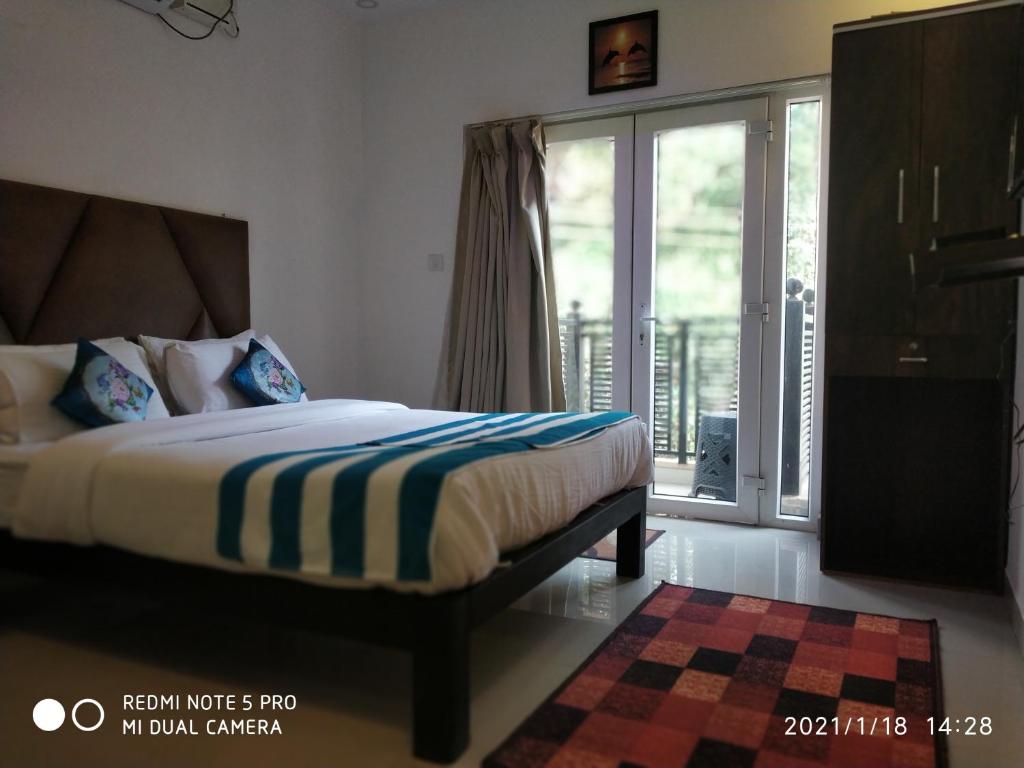 Postel nebo postele na pokoji v ubytování The Balaji inn Baga