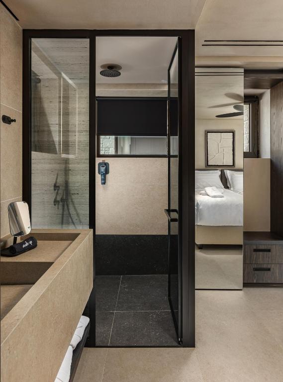Postel nebo postele na pokoji v ubytování Omega Residences