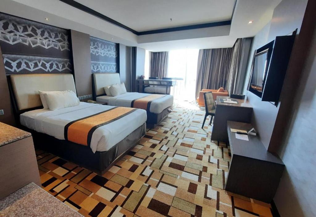 Postel nebo postele na pokoji v ubytování Grand Paragon Hotel Johor Bahru