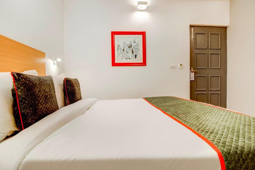 Postel nebo postele na pokoji v ubytování Hotel O Star Key