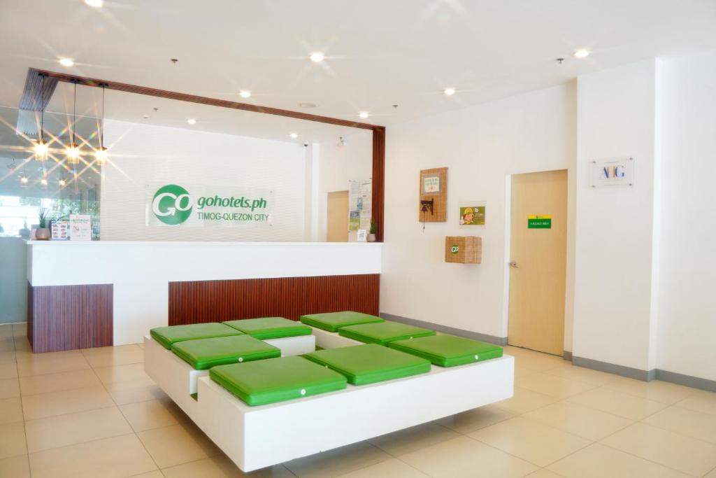 Postel nebo postele na pokoji v ubytování Go Hotels Timog