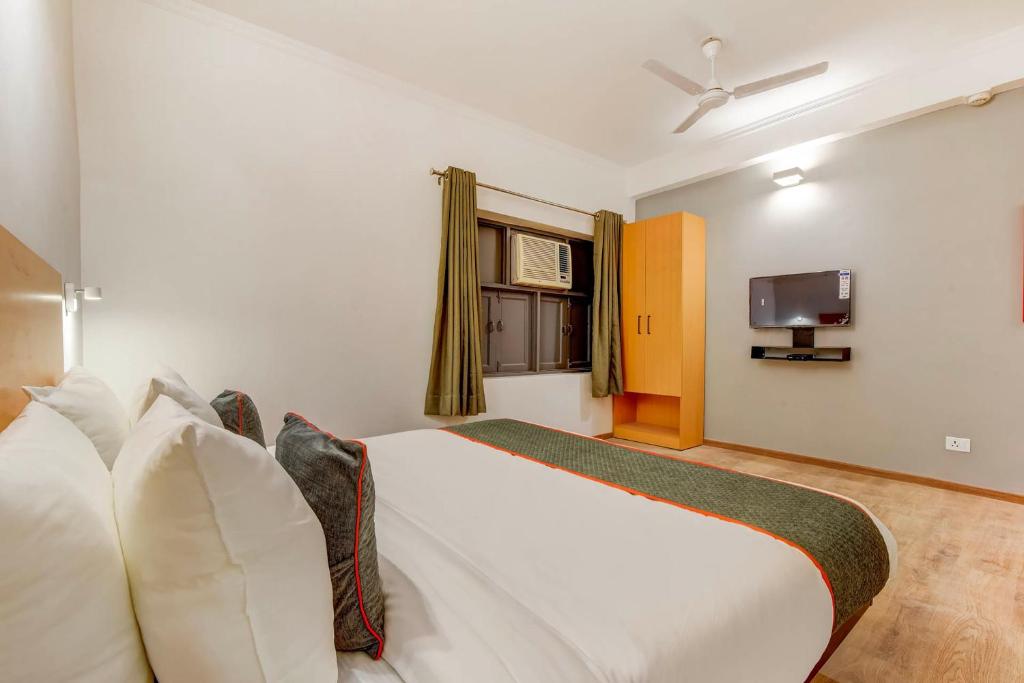 Postel nebo postele na pokoji v ubytování Hotel O Star Key