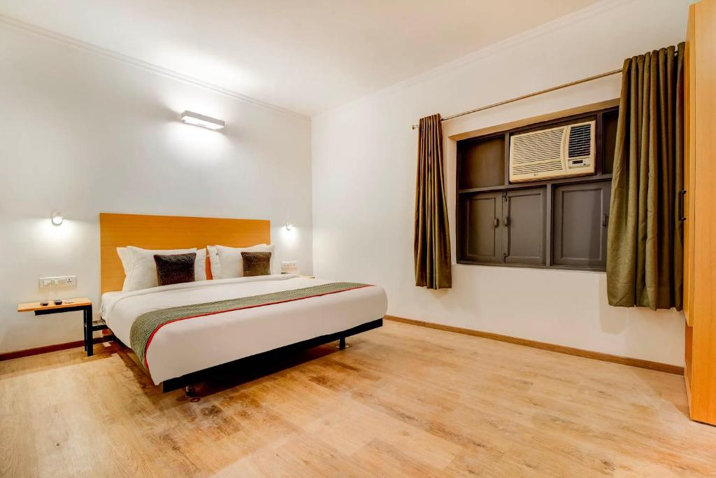 Postel nebo postele na pokoji v ubytování Hotel O Star Key