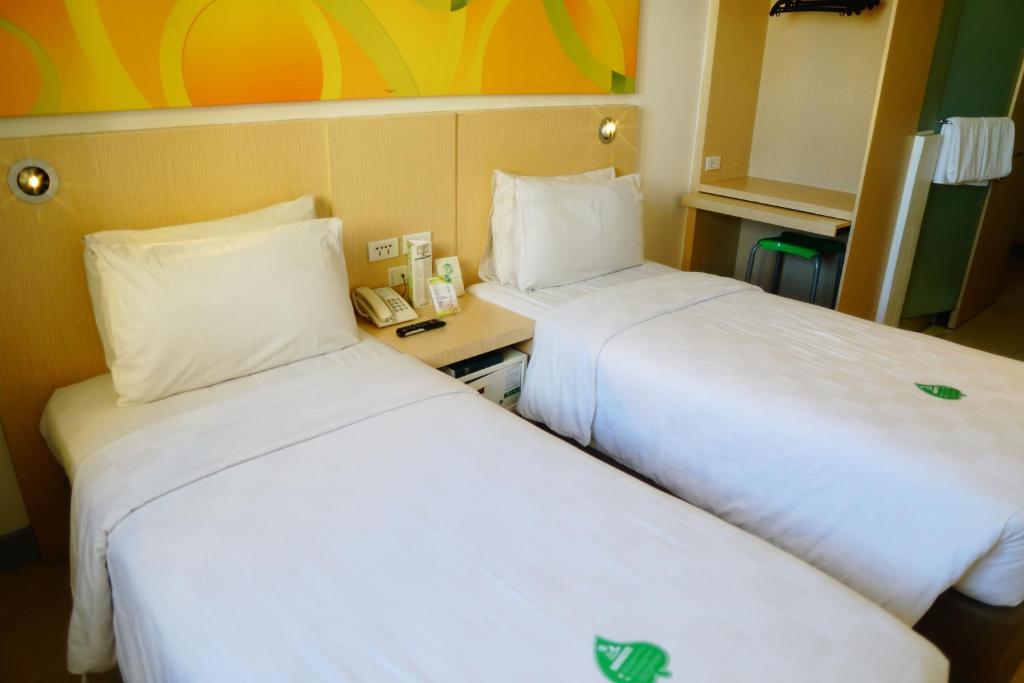 Postel nebo postele na pokoji v ubytování Go Hotels Ermita, Manila