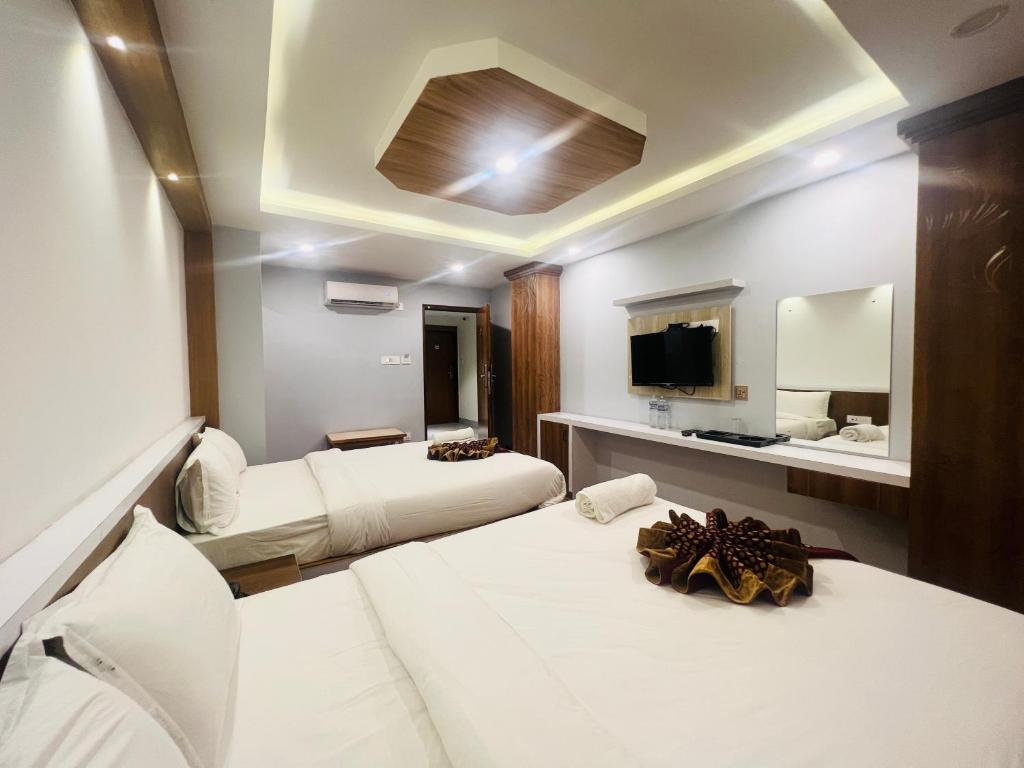 Cama o camas de una habitación en Hotel Nirakar
