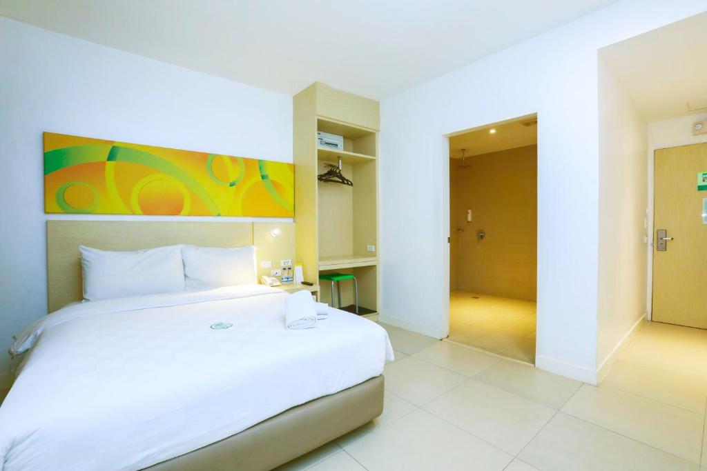Postel nebo postele na pokoji v ubytování Go Hotels Ermita, Manila