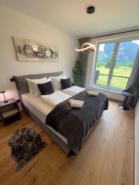 Postel nebo postele na pokoji v ubytování Riverstone Retreat Bovec