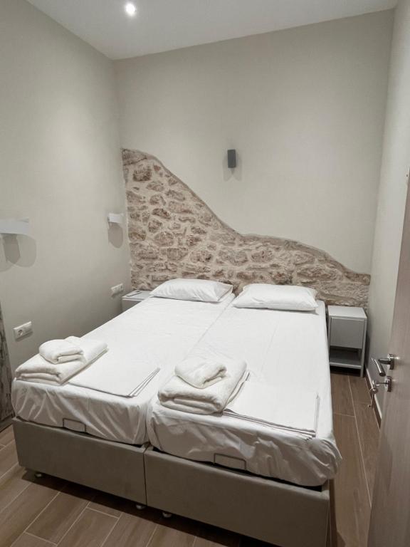 Postel nebo postele na pokoji v ubytování Aphaia Serenity Apartment