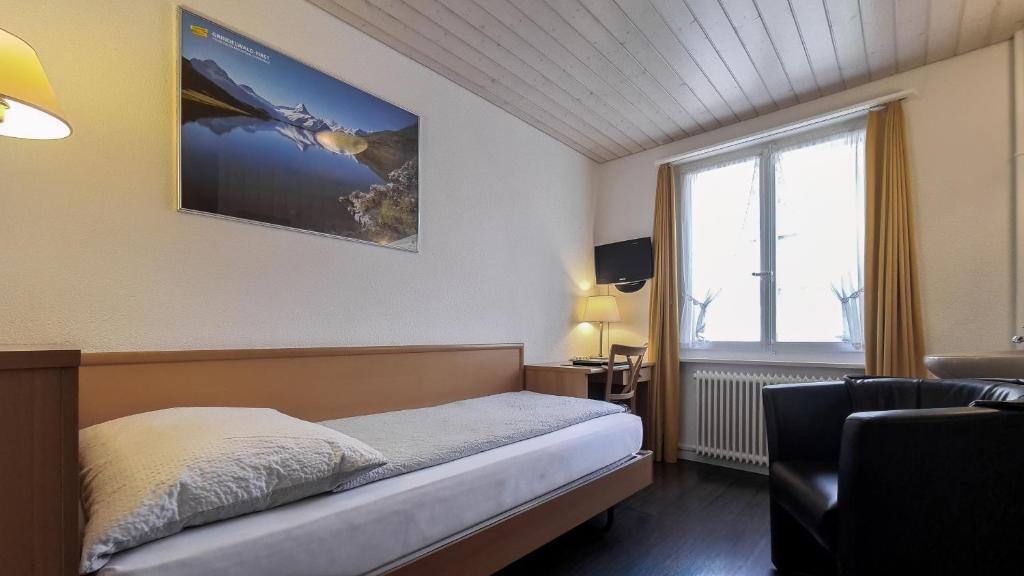 Postel nebo postele na pokoji v ubytování Hotel Rössli