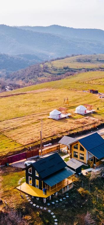 an overhead view of a house with a blue roof at Дом в горах Уютный дом с потрясающим видом и огромной террасой in Besqaynar